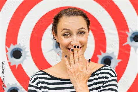 woman laughing  hand covering  smile stock photo  royalty  images  fotoliacom