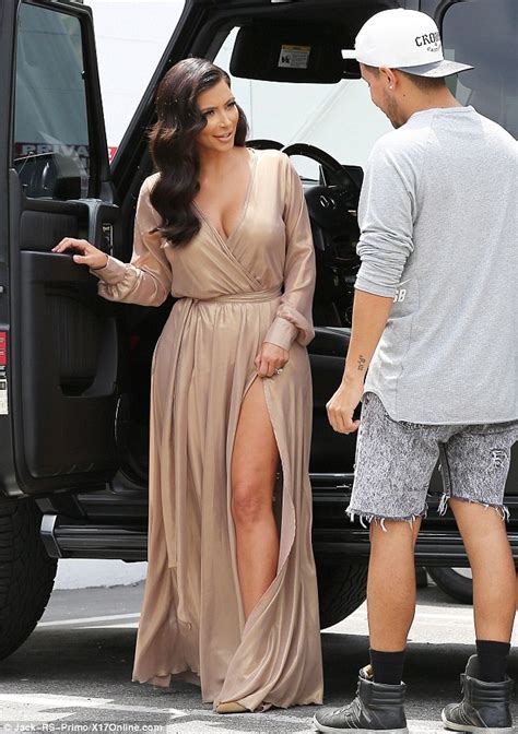 kim kardashian sizzles in sexy beige dress with high cut
