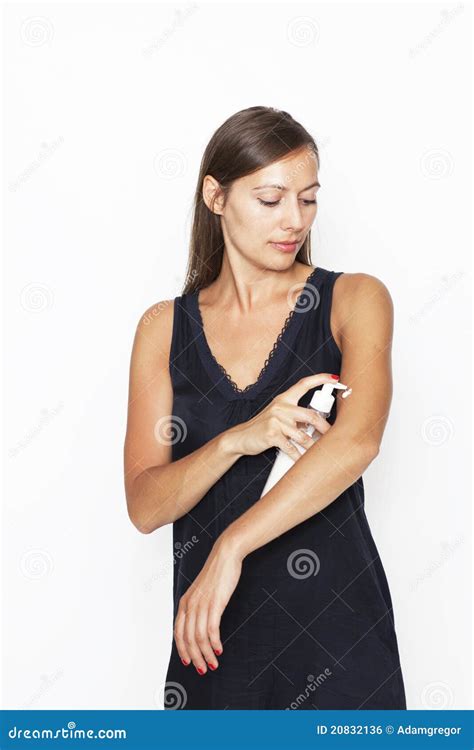 Attractive Woman Putting Lotion On Her Body Royalty Free Stock Image