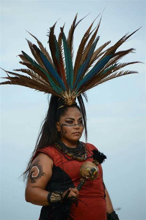 woman playing morraca aztec costume aztec warrior aztec headdress