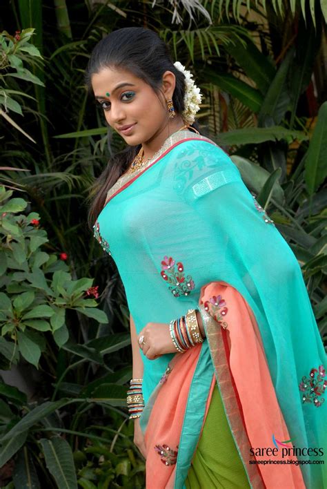 priyamani poses in a beautiful blue thin saree pics
