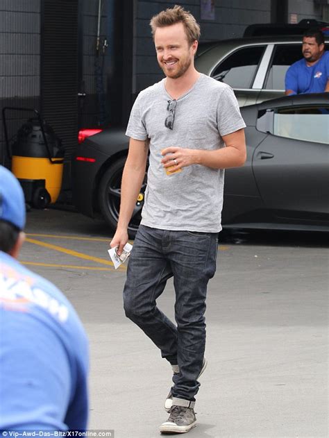 aaron paul shows off his tanned arms while getting his car cleaned