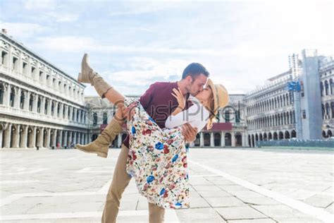 beautiful couple in love in venice italy romantic lovers kissing stock
