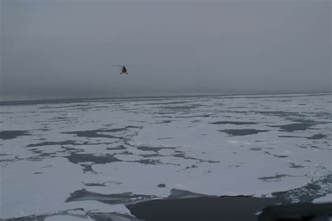 Canadian Helicopter Flying Over Arctic Ocean