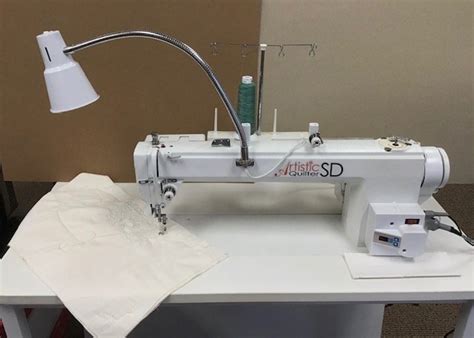 janome artistic quilter sd sit  long arm machine