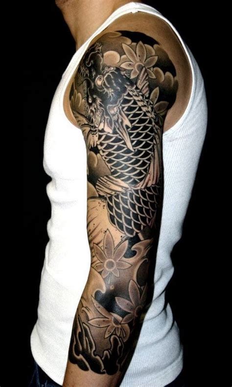 man   dragon tattoo   arm  shoulder standing  front   black background