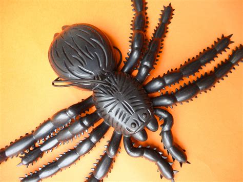 image  plastic spider toy  orange background creepyhalloweenimages