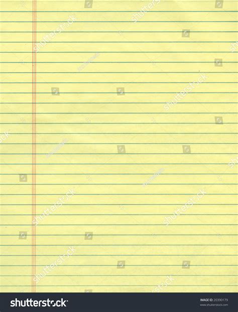 sheet  ordinary yellow ruled exercise paper stock photo