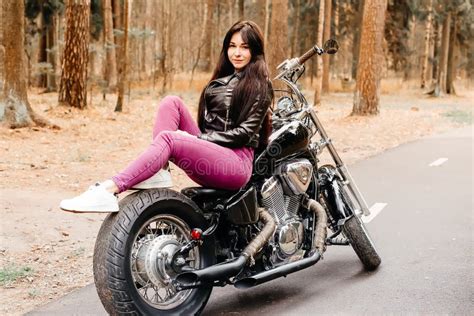 Beautiful Brunette Riding A Motorcycle In The Park Stock Image Image