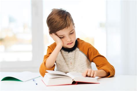 student boy reading book  textbook  home homeschooling  dyslexia