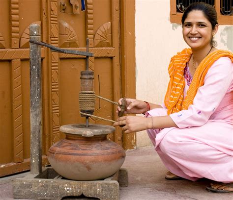 In India The Traditional Indian Butter Churn Is Operated By The