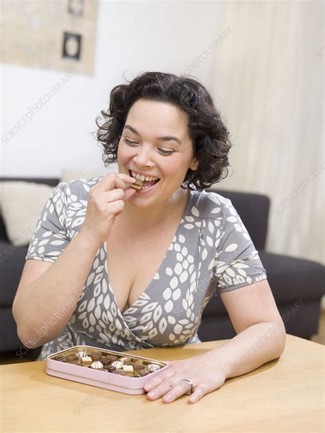 Woman Eating Chocolate Candy Stock Image F003 7227 Science Photo