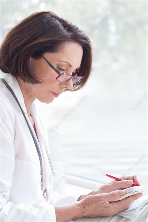 Female Doctor Wearing Glasses With Device Stock Image F020 7505