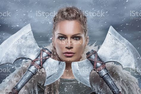 beautiful blonde weapon wielding female viking warrior queen stock