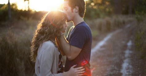 beautiful couple kiss romantic hold hug affection sunset