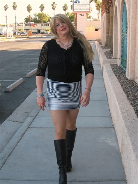 tall boots long legs mini skirt and lace top a photo on
