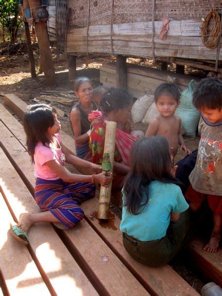 villagers smoking bamboo water pipe photo