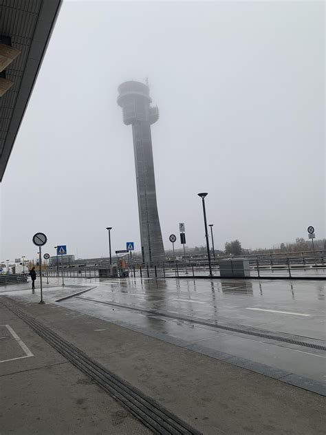 oslo airport tower in foggy conditions this morning
