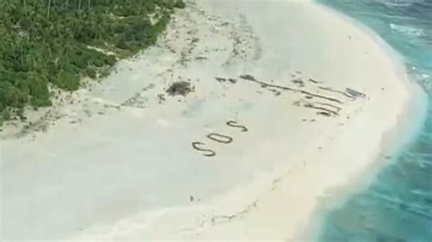 sos message in sand saves three men stranded on deserted