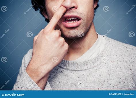 young man  picking  nose stock image image  human male