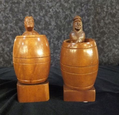 pair of adult novelty items man and woman in barrel