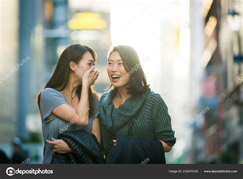 Two Girlfriends Meeting Outdoors Having Fun Japanese People Bonding