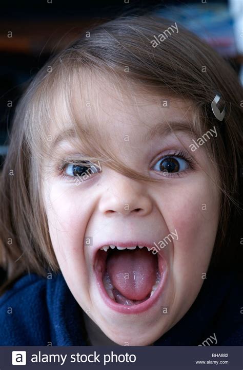 happy child shouting mouth open happy children portraits stock photo
