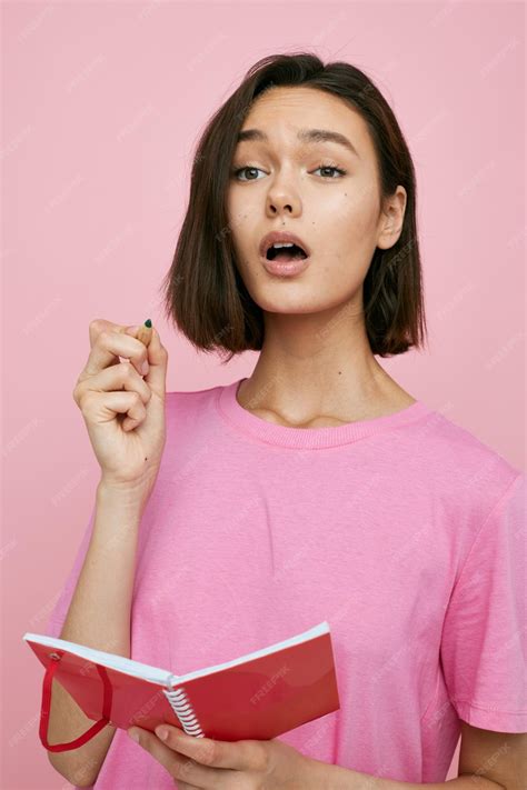 Premium Photo Short Haired Brunette Notepad For Writing Ideas Pink