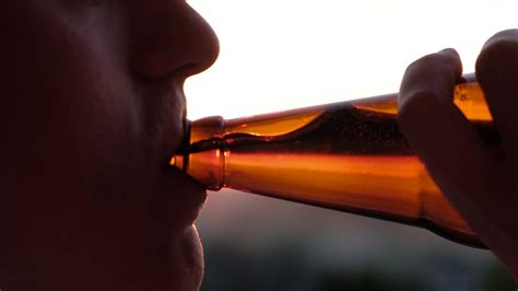 a man drinking beer at sunset close up stock footage sbv 338531638