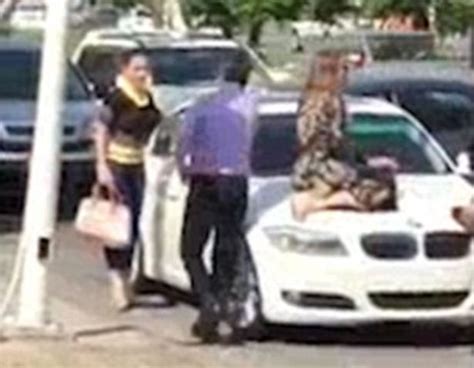 Scorned Wife Sits On Cheating Husbands Car Bonnet To Stop Him Driving