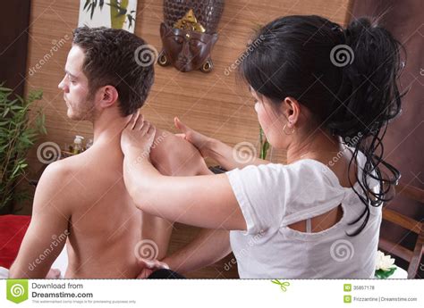 Thai Woman Making Massage At A Man In Spa Royalty Free