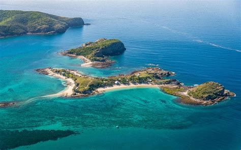 the curious tale of xxxx island from beer soaked man cave to tropical idyll