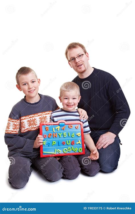 father teaching  boys royalty  stock photo image
