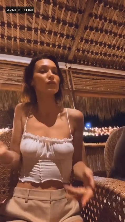 bella hadid shows her pokies during dancing braless in a white top in