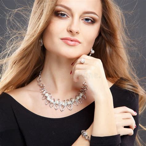 Close Up Portrait Of Beautiful Young Woman With Luxury Jewelry And