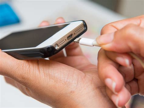 properly clean  iphones charging port business insider