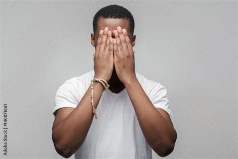 Depressed African American Man With Hands On Face Unhappy Guy Bothered