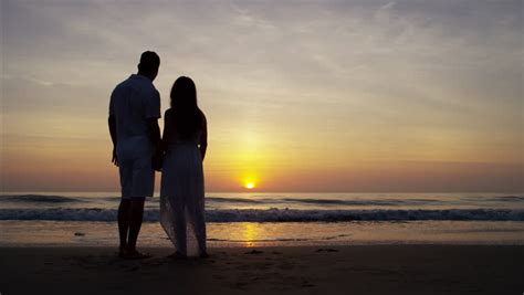 couple love at sunset hd1080 couple as a silhouette walk in scene
