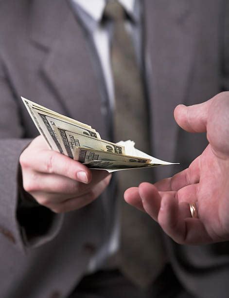 hand holding money pictures images  stock  istock