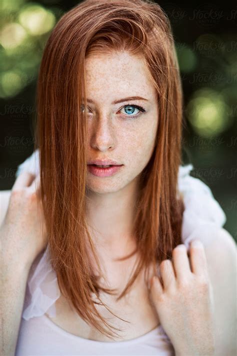 beautiful redhead with freckles by stocksy contributor maja topcagic