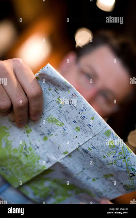 male traveler studies  map stock photo alamy