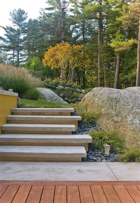 concrete steps boulders google search landscaping  rocks