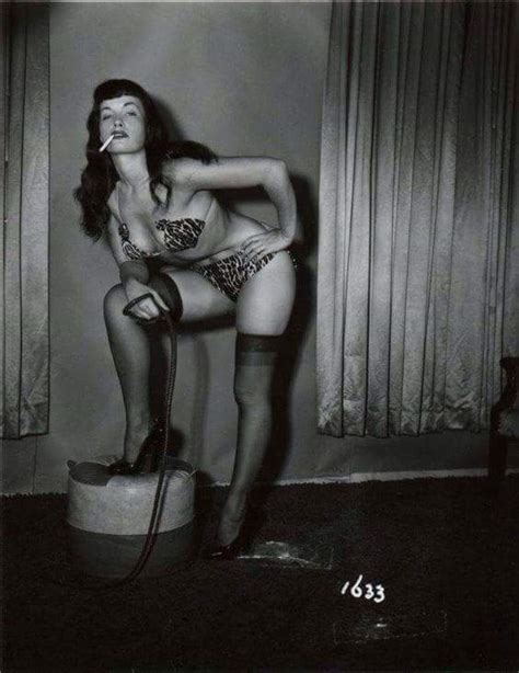 bettie page posing with a whip and a cigarette c 1952 imgur