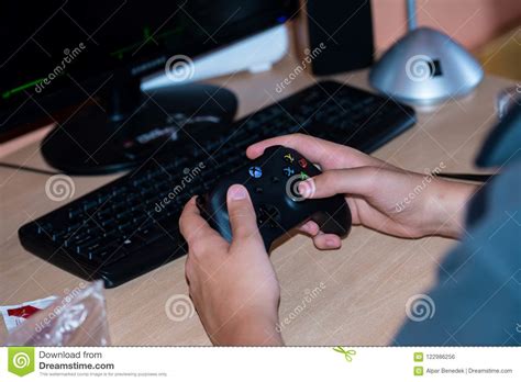 young boy playing  xbox  video game  personal computer editorial photo image