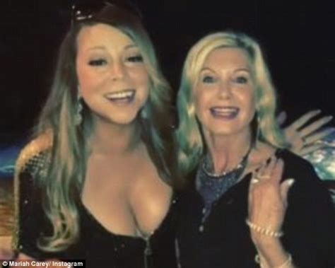 mariah carey flashes ample cleavage with olivia newton john in las vegas daily mail online