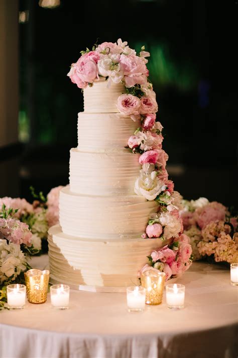 white cake decorated with peonies