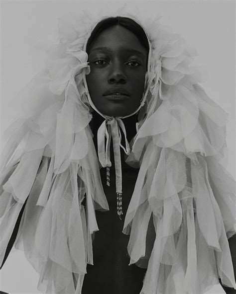 black  white photo   woman  large ruffles   head