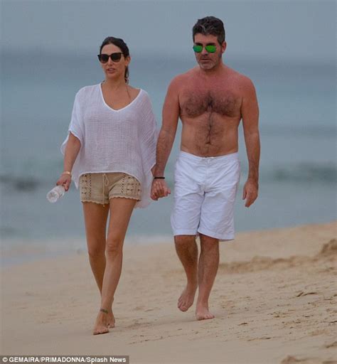 simon cowell and lauren silverman enjoy a romantic stroll together