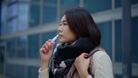 Sorrowful Asian Woman Is Smoking Stock Footage Video 100