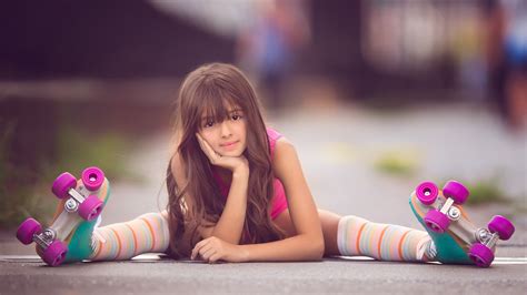 cute  girl skater  sitting  road holding face  hand